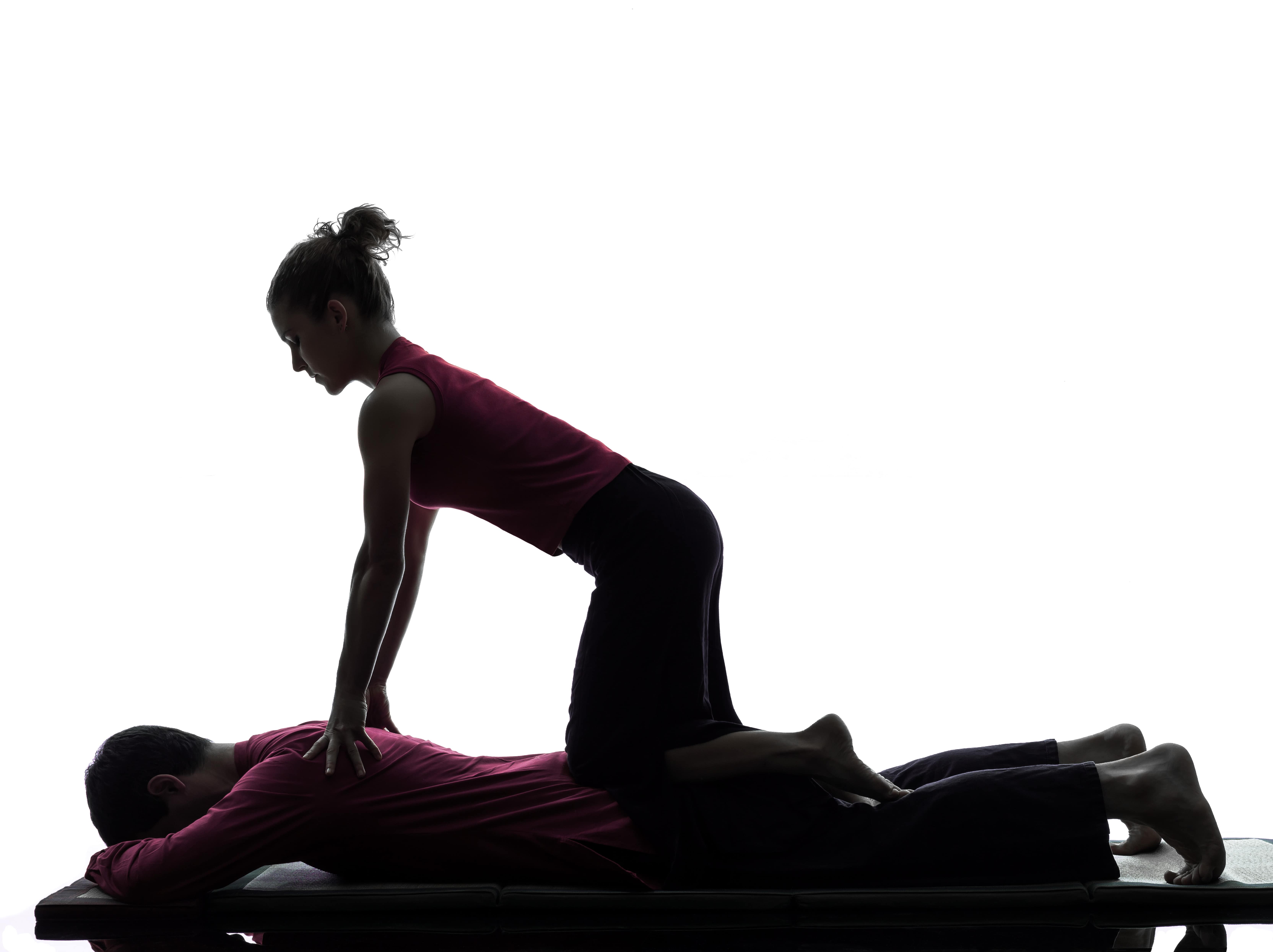 shiatsu practitioner giving shiatsu massage to a client